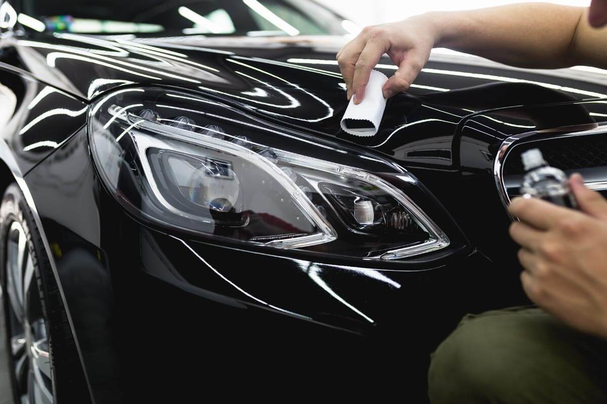 Protection Labs technician applying a coating on a Mercedes E-Class